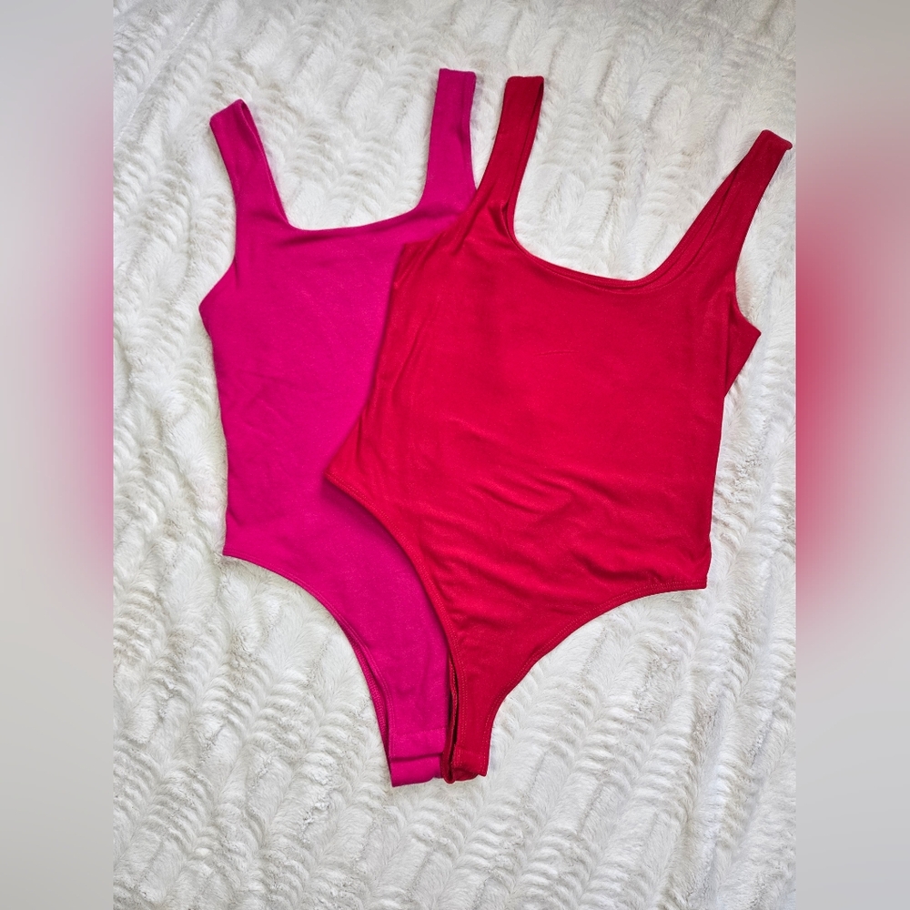 Red and hot pink bodysuits